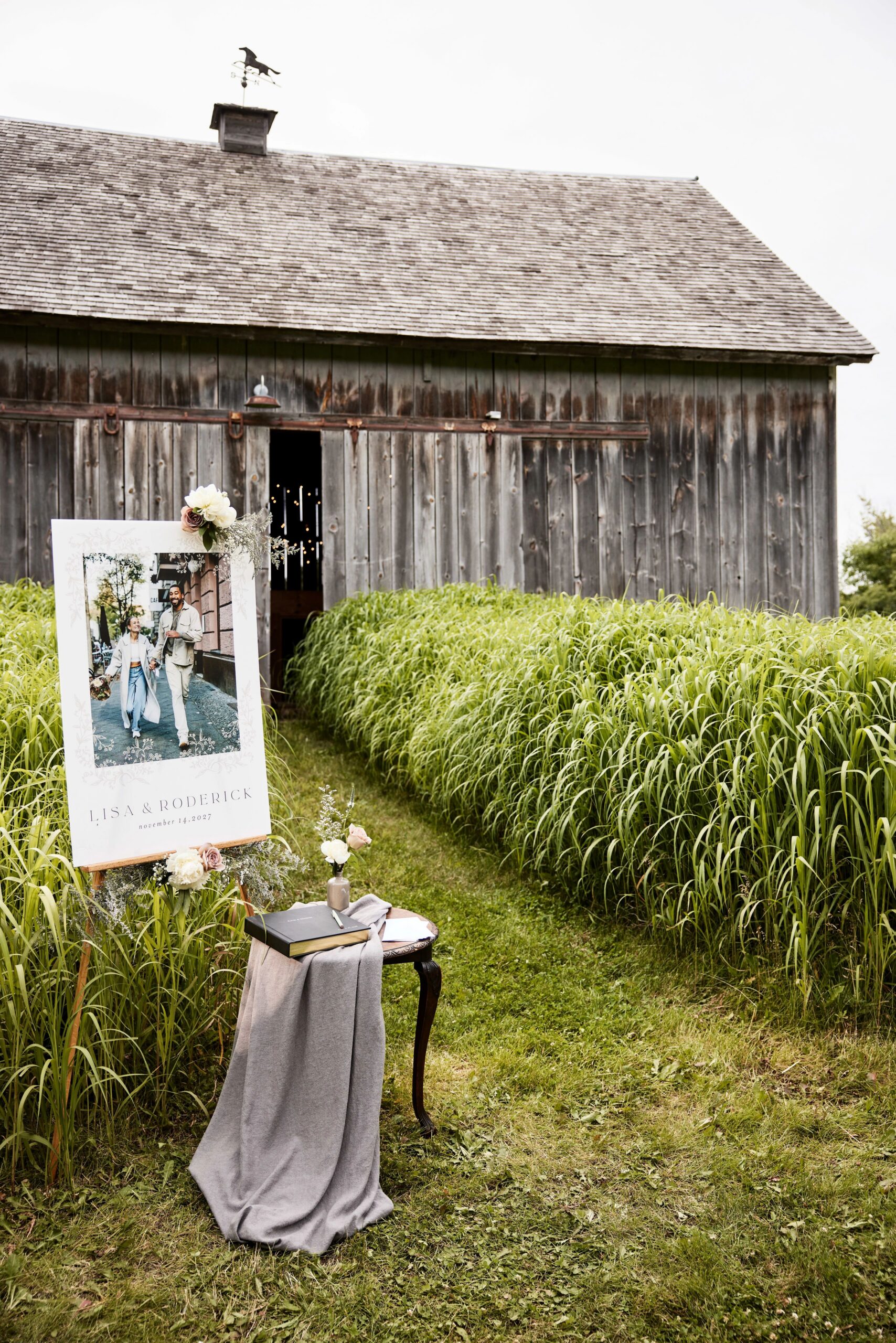 wedding celebration photo board next to guest book