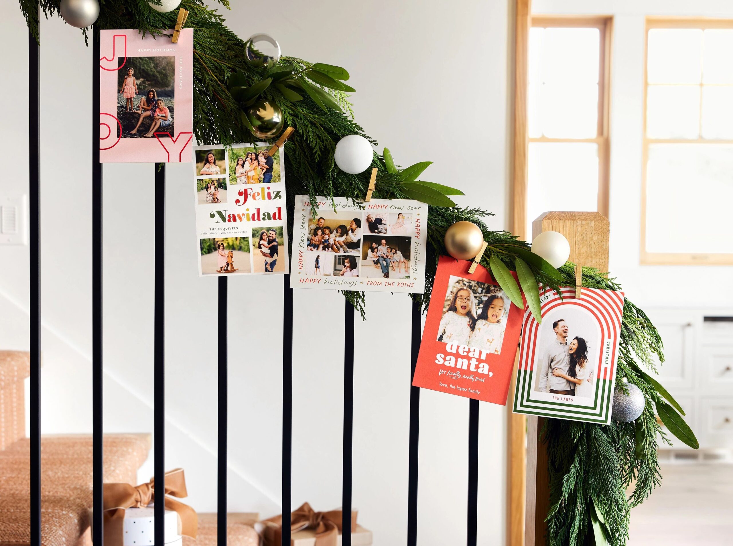 christmas cards hanging on the staircase