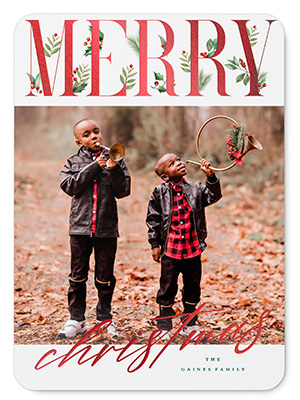 merry christmas card with photo of young brothers in matching clothes playing in the leaves