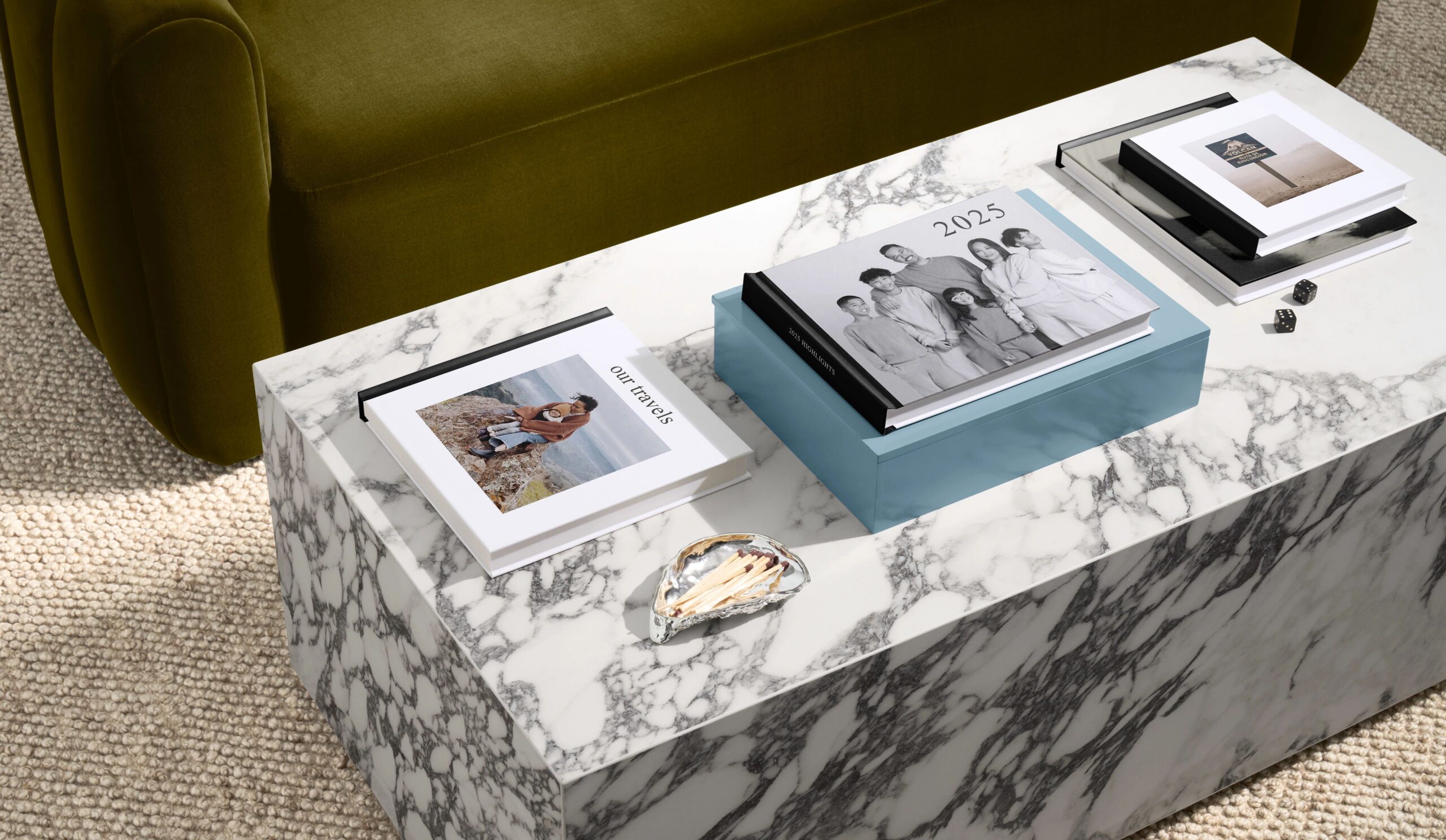 year in review photo books on a coffee table