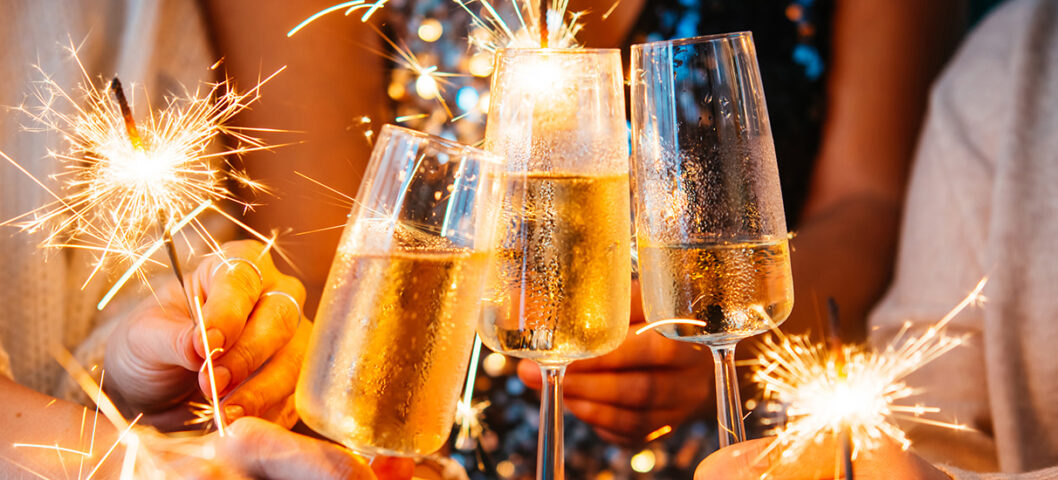 people clinking champagne glasses