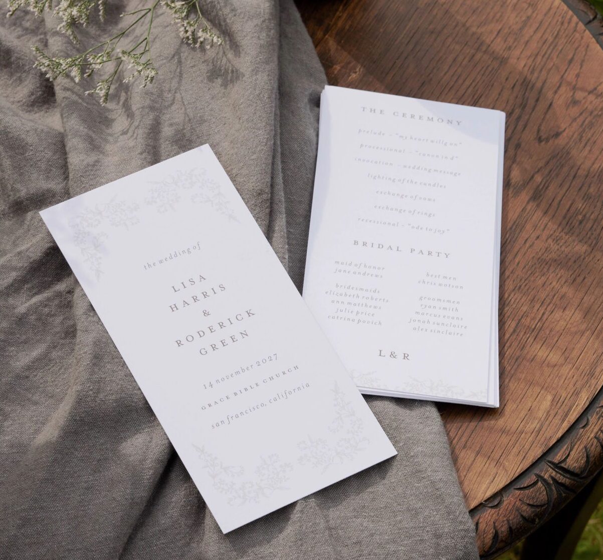 two wedding programs on a table