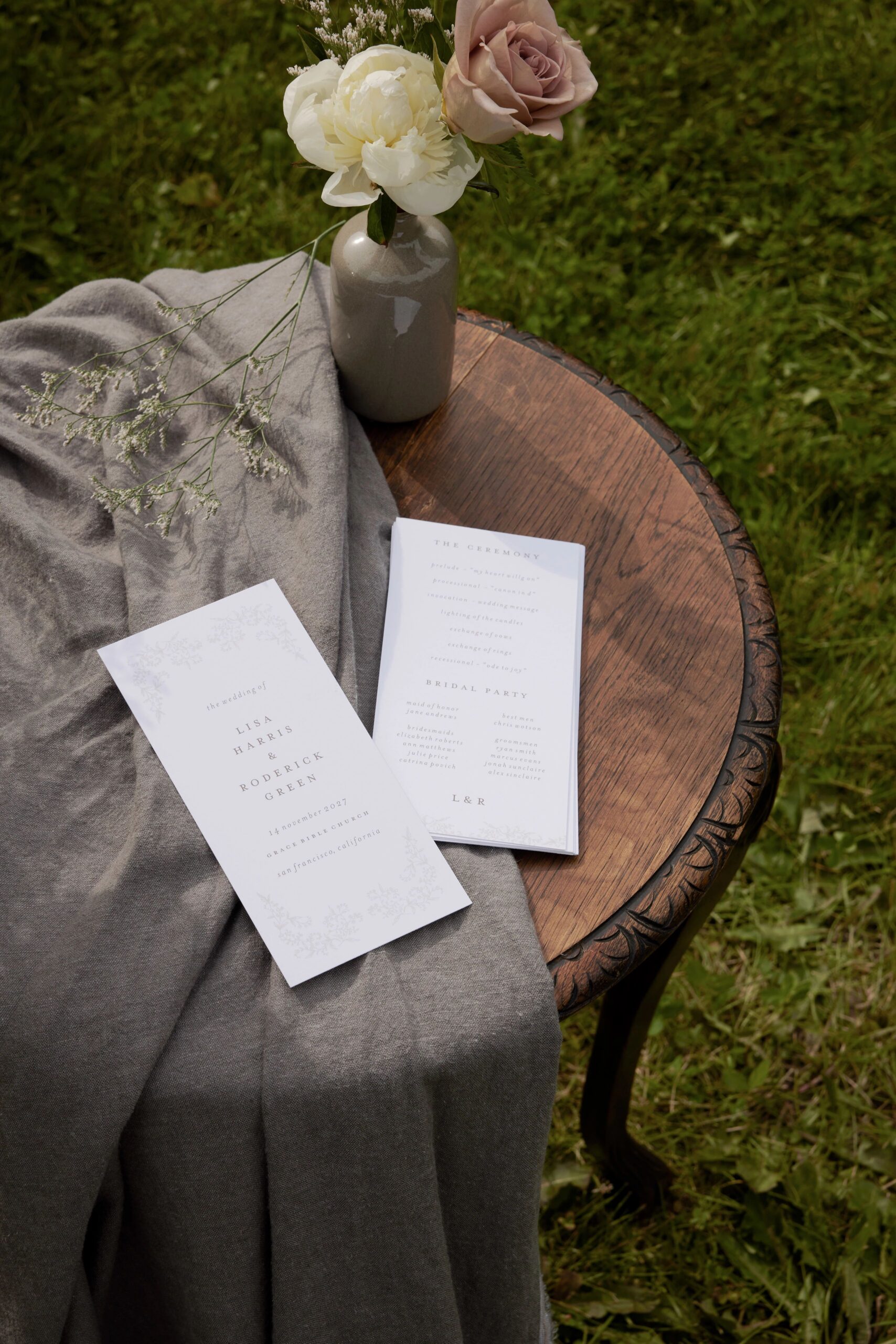 two wedding programs on a table