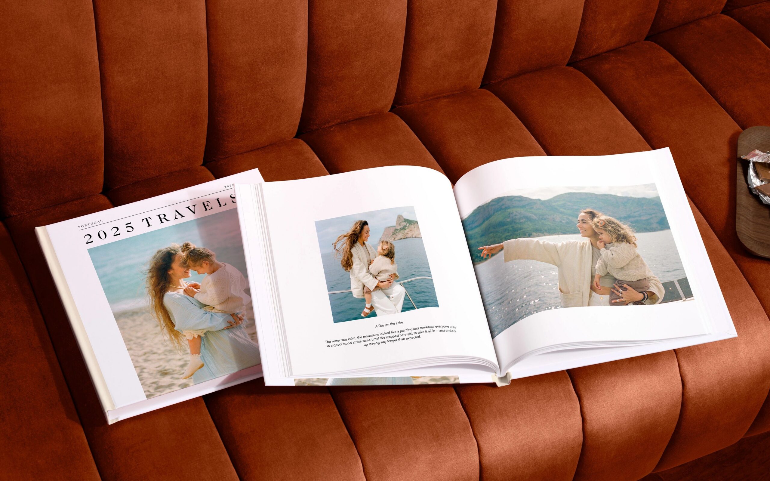 open travel photo book on couch