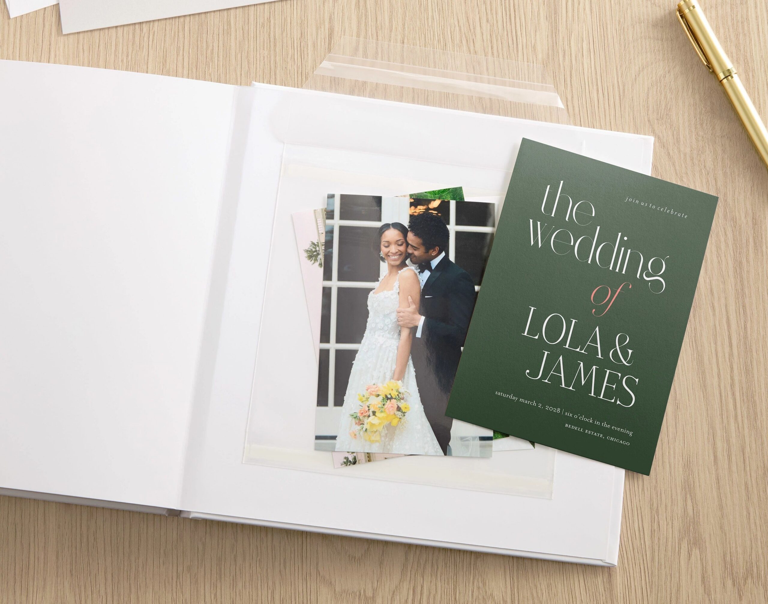 wedding invitation flatlay on photo album