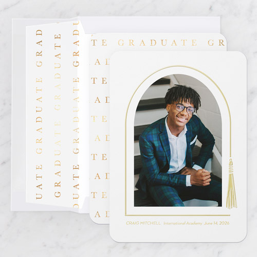 boy sitting on stairs on graduation announcement