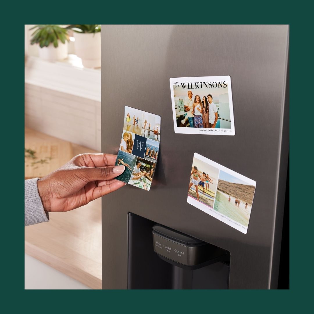three photo magnets on a fridge