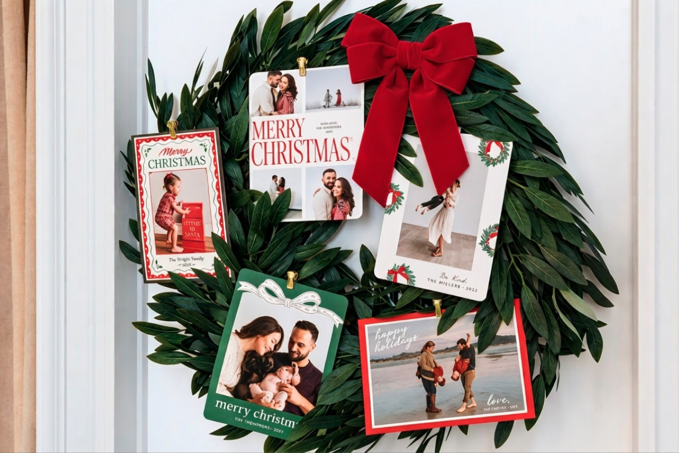 chrsitmas cards displayed on a wreath