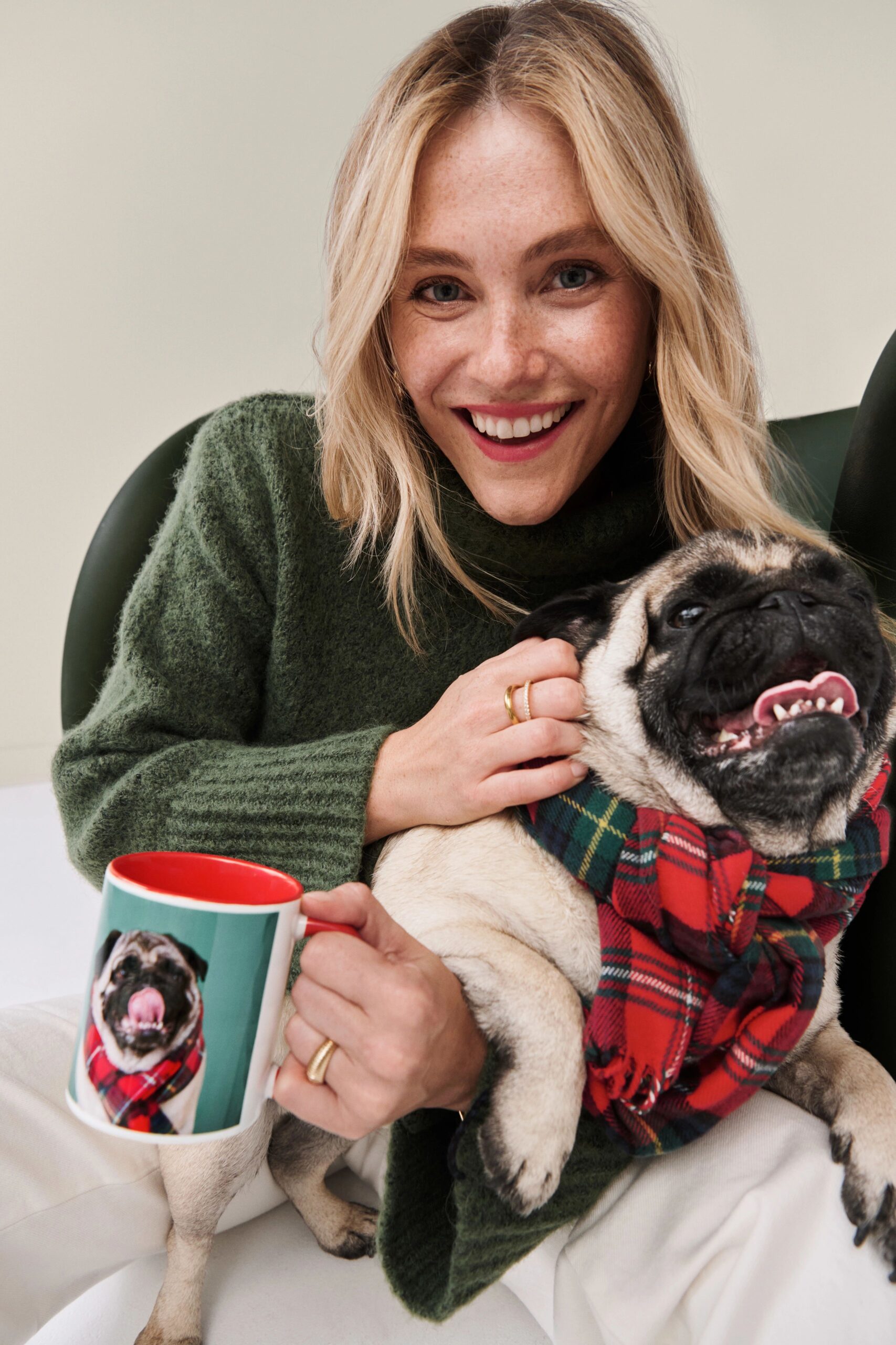 woman holding a dog and photo mug