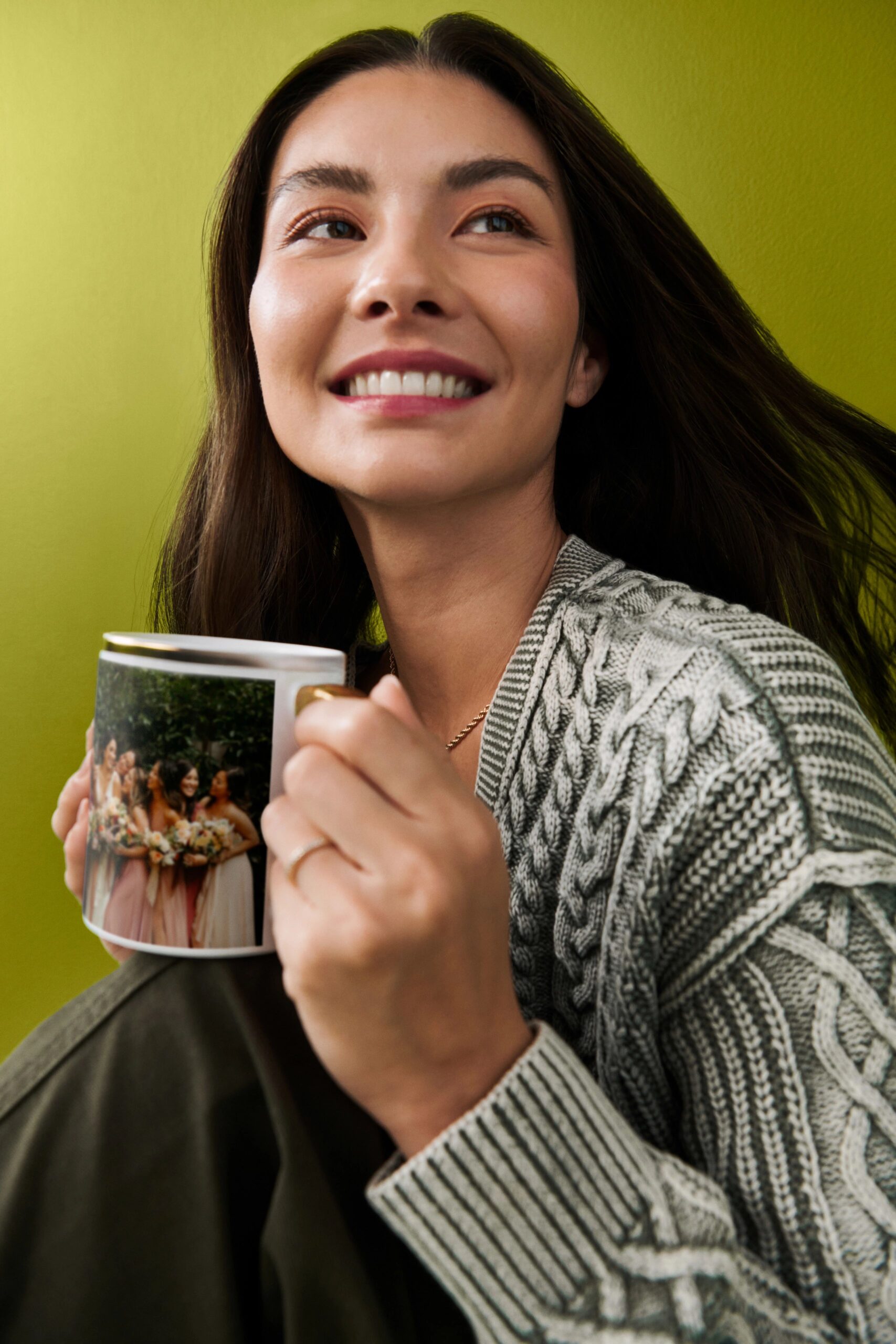 woman holding photo mug