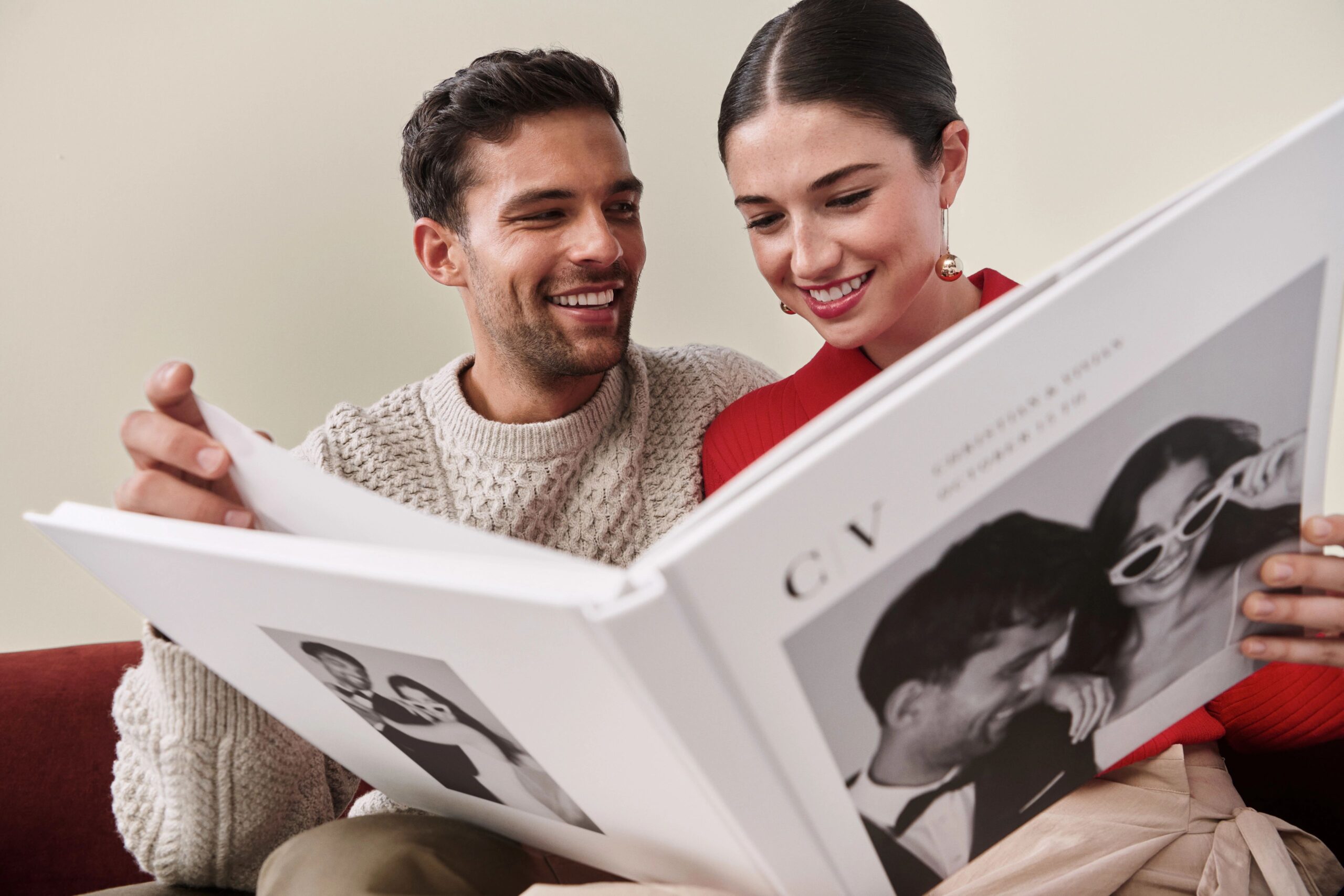 couple flipping through photo book