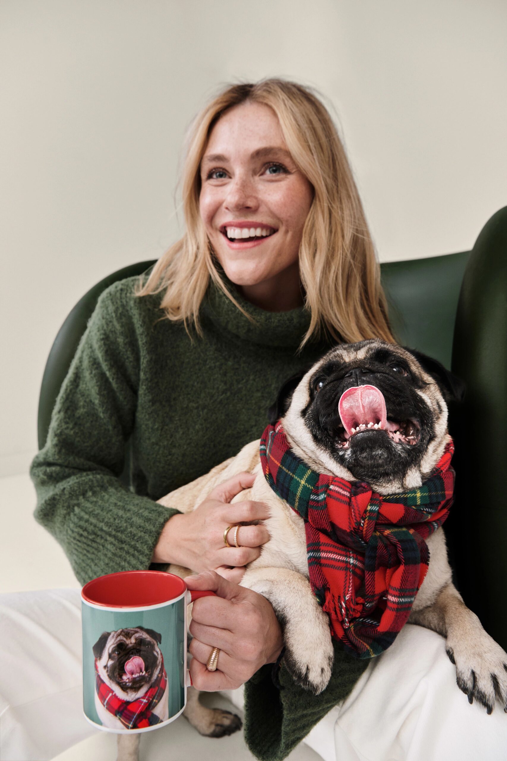 girl holding dog and a photo mug that has a picture of her dog
