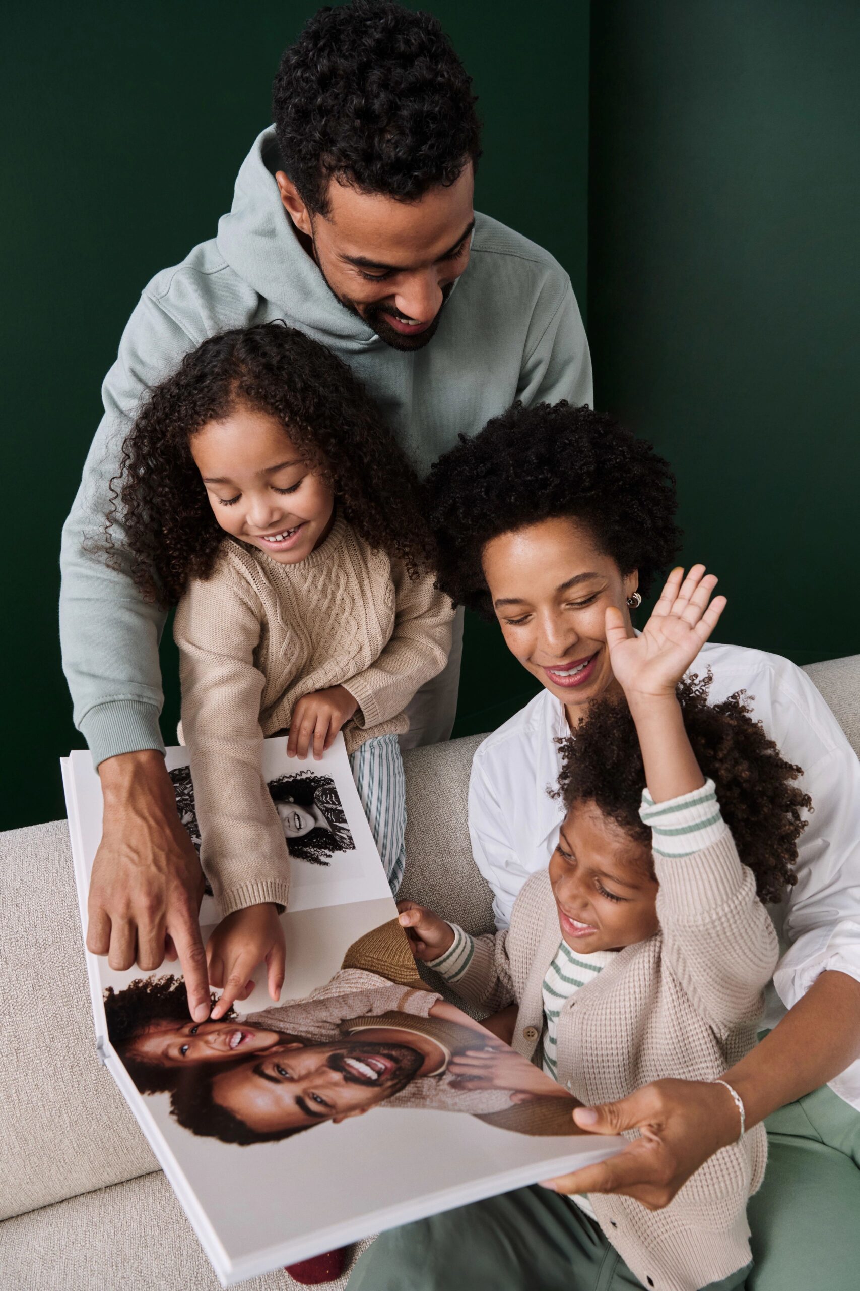 family flipping through a photo book