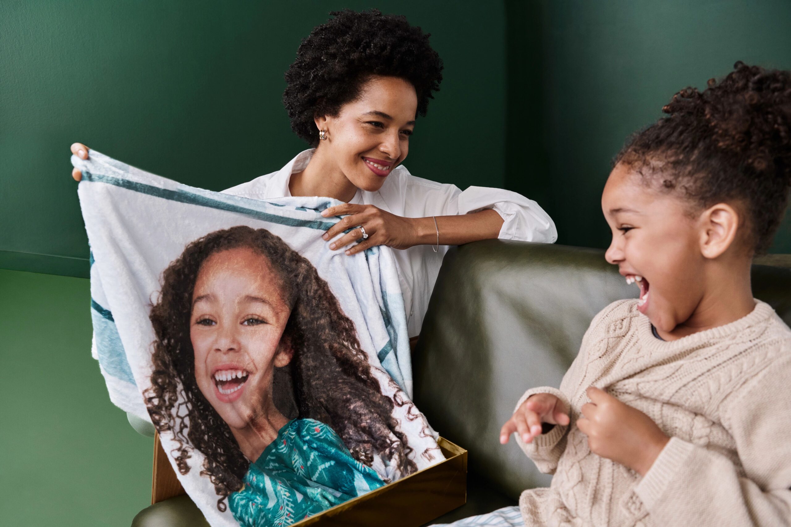 mom and daughter looking at fleece photo blanket