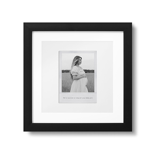 black and white photo of a pregnant woman on a framed print