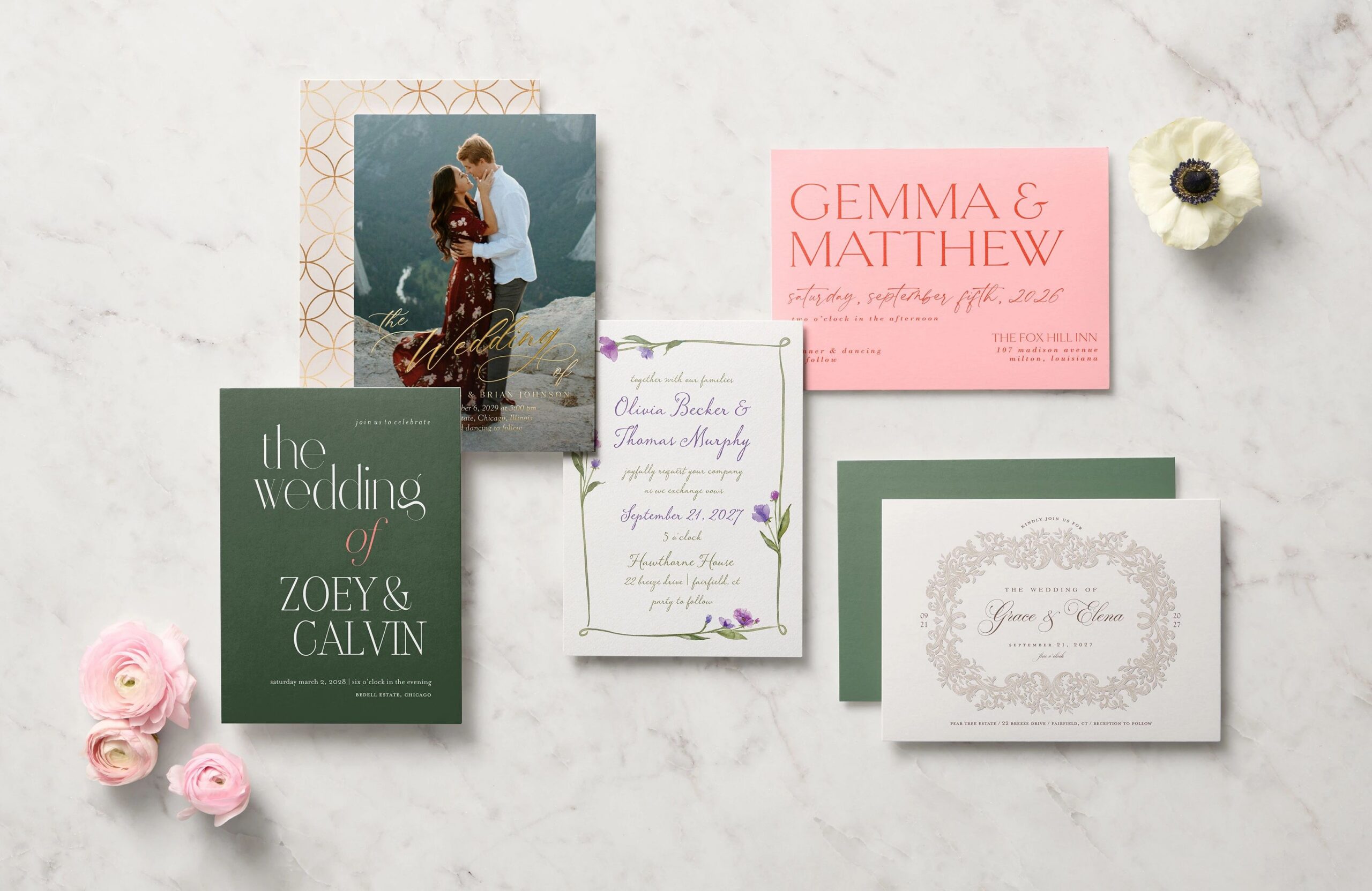 flat lay of different wedding invitations