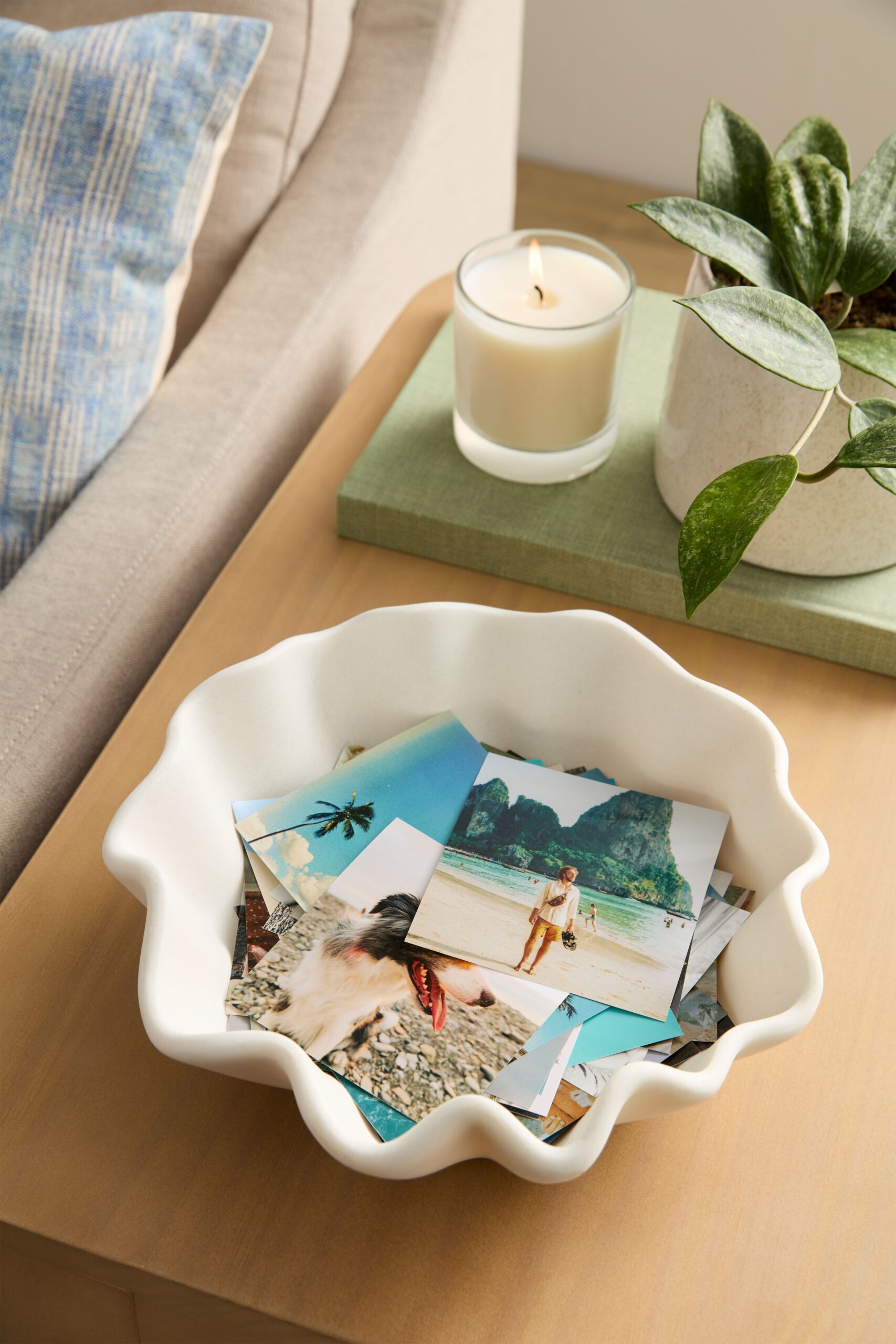 4x4 photo prints in a bowl on a table