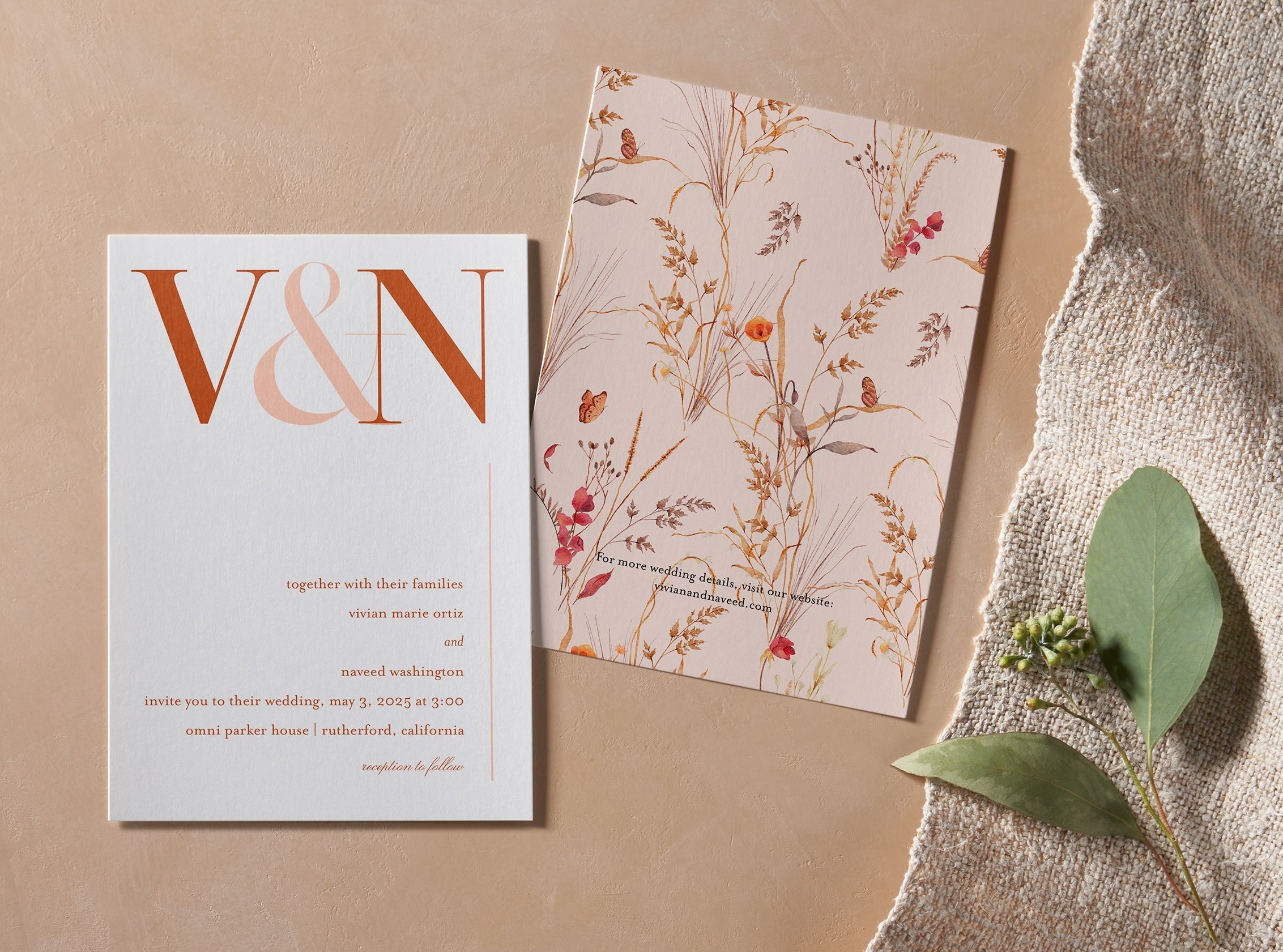 flat lay of wedding invitation and back of card design