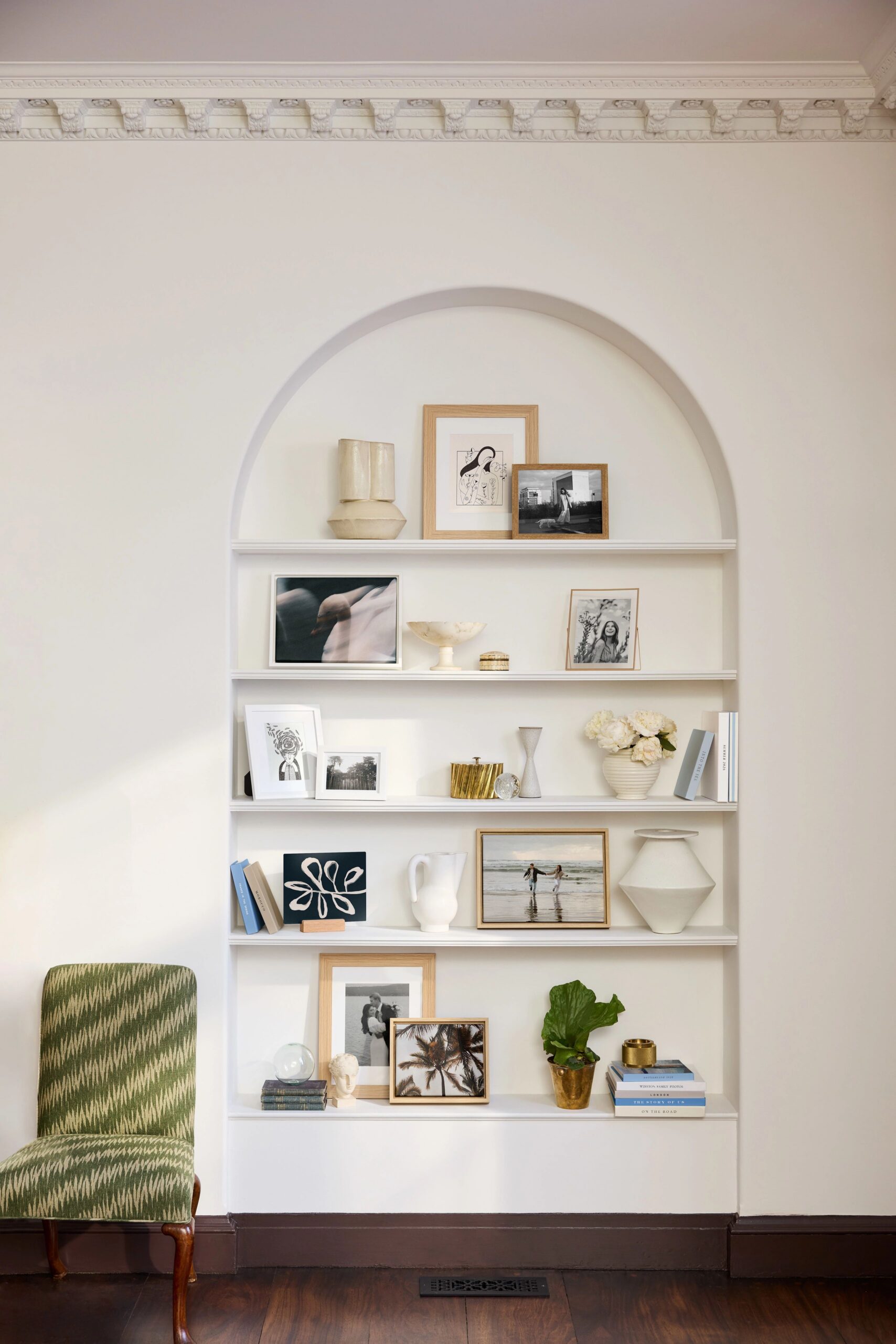 tabletop prints displayed on built in shelf