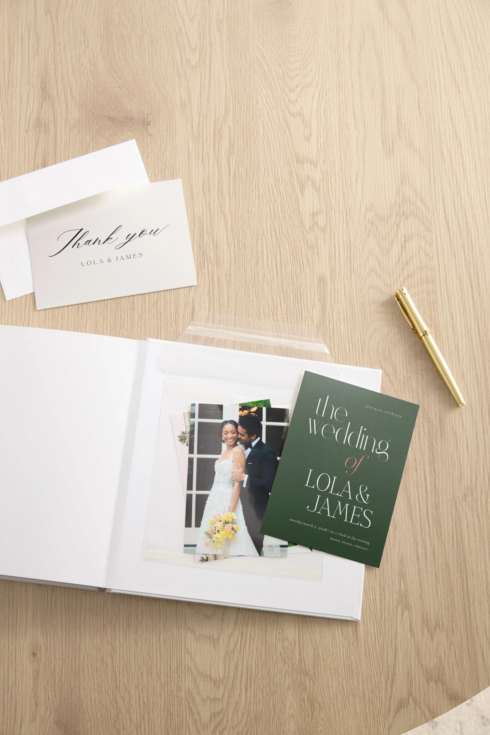 wedding scrapbook with wedding photo prints and thank you card and invitation