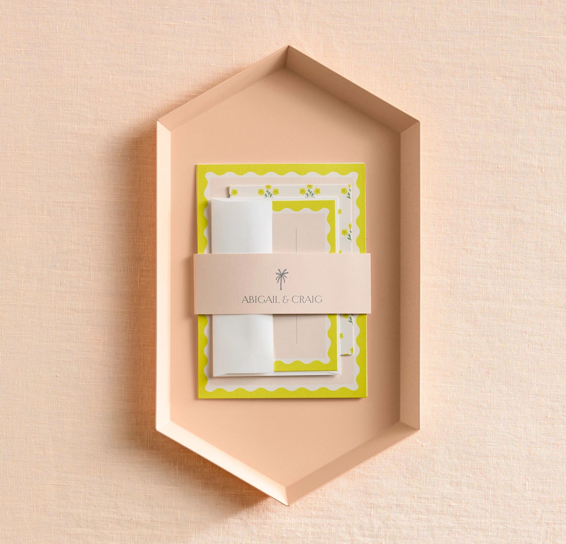 belly band holding together wedding invitation and other stationery
