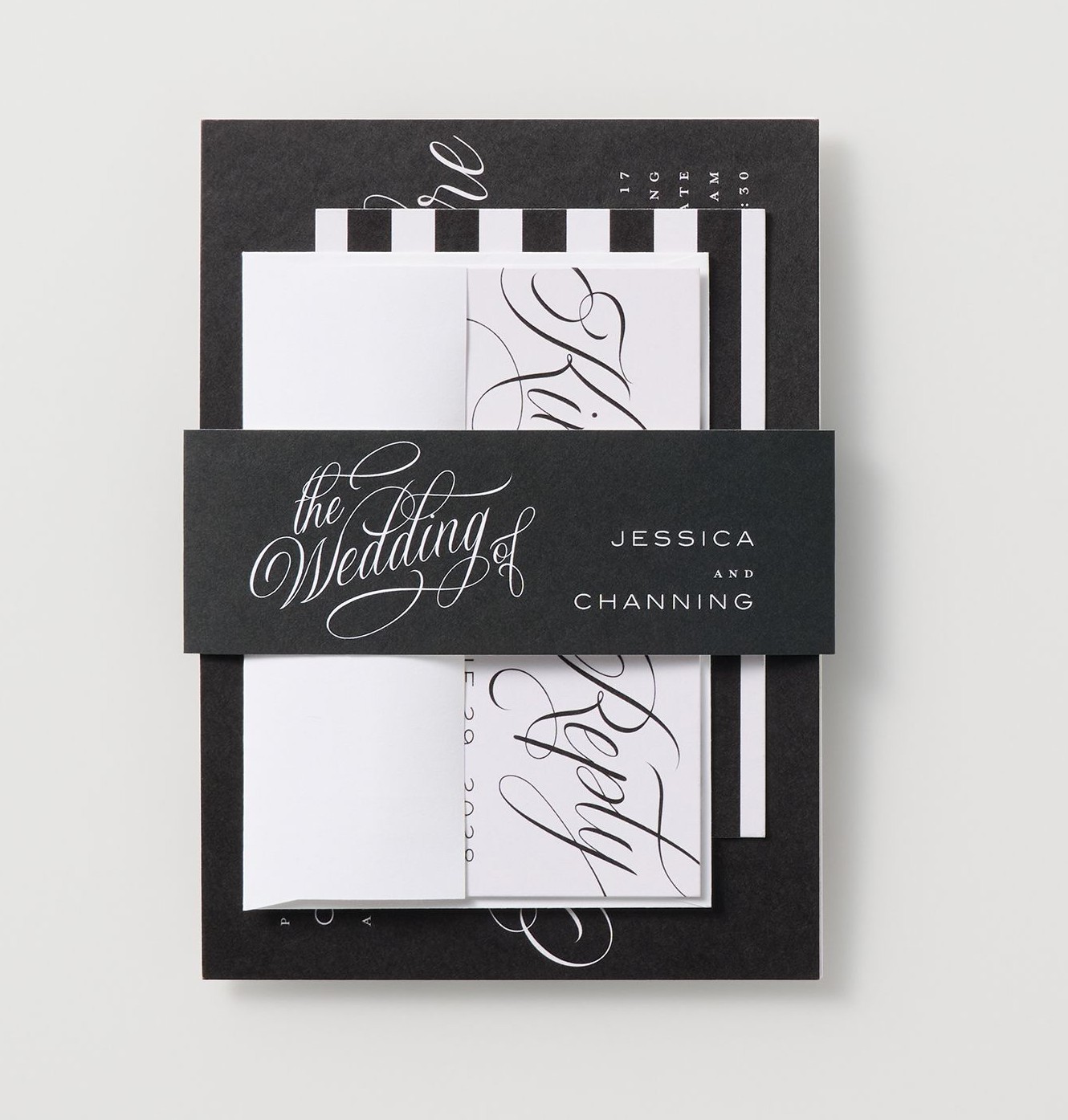 belly band holding together wedding invitation and other stationery