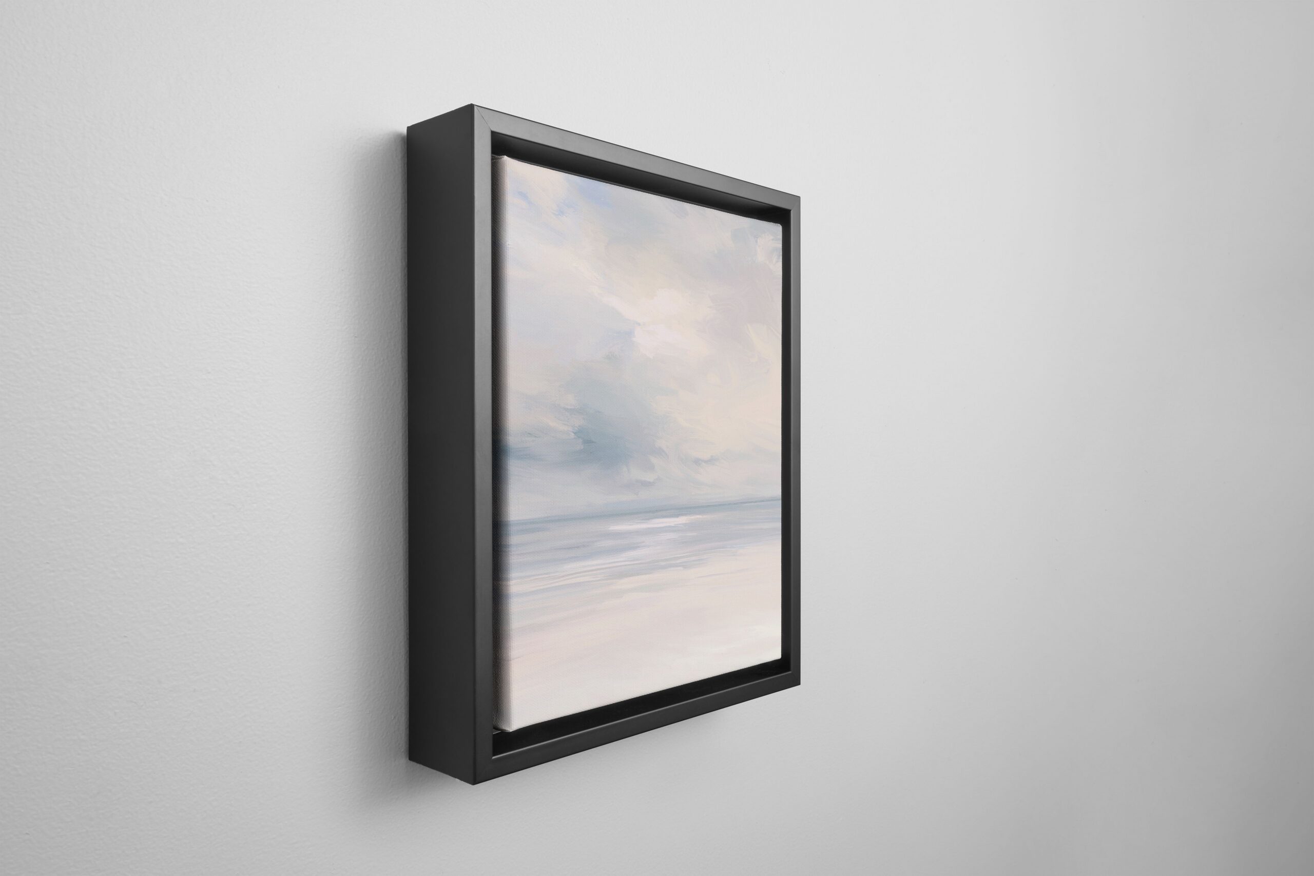 framed canvas print with a black frame hanging on a wall