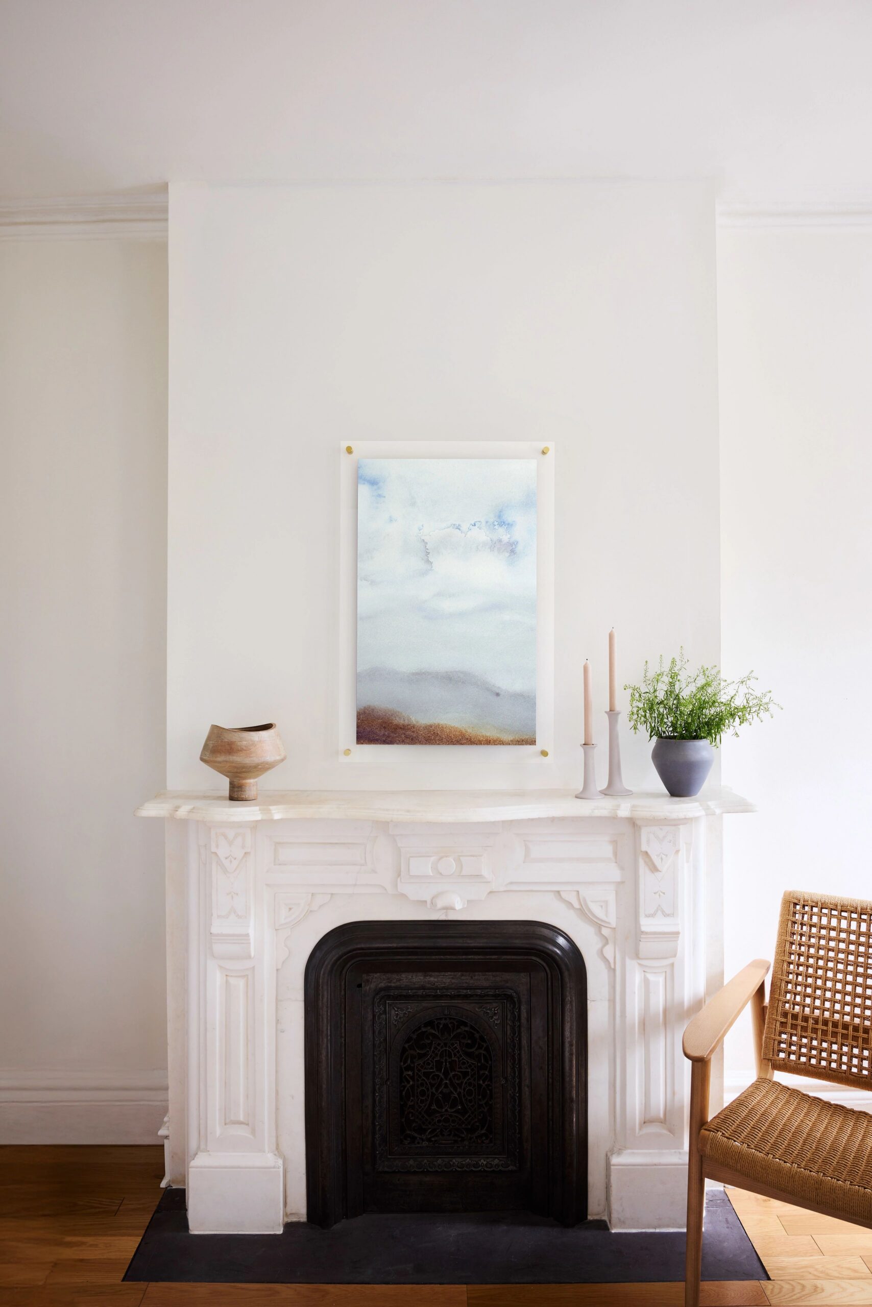 large acrylic photo print hanging above fireplace