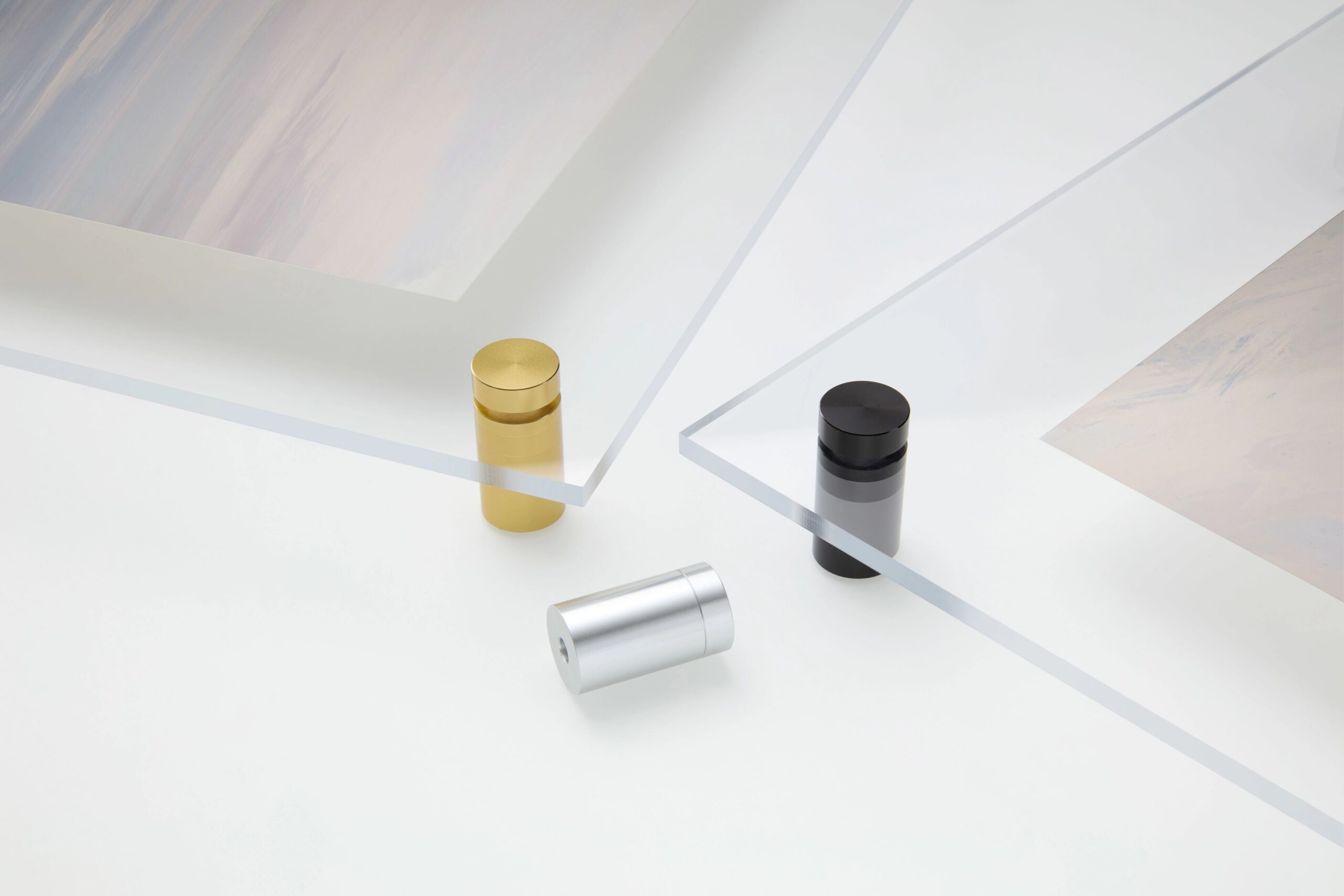 close up of gold, black, and silver acrylic print bolts