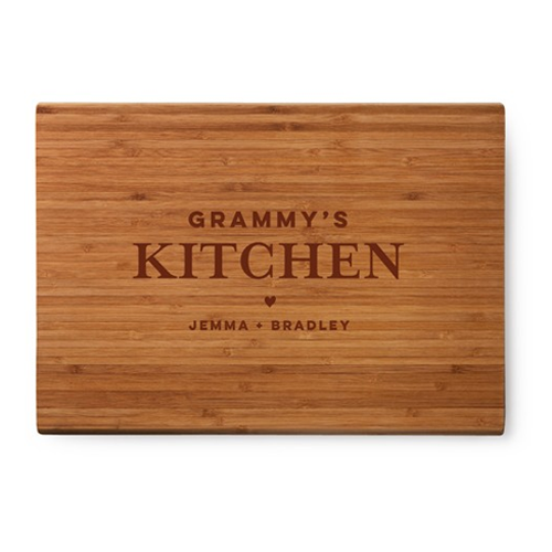 engraved cutting board that says grammy's kitchen