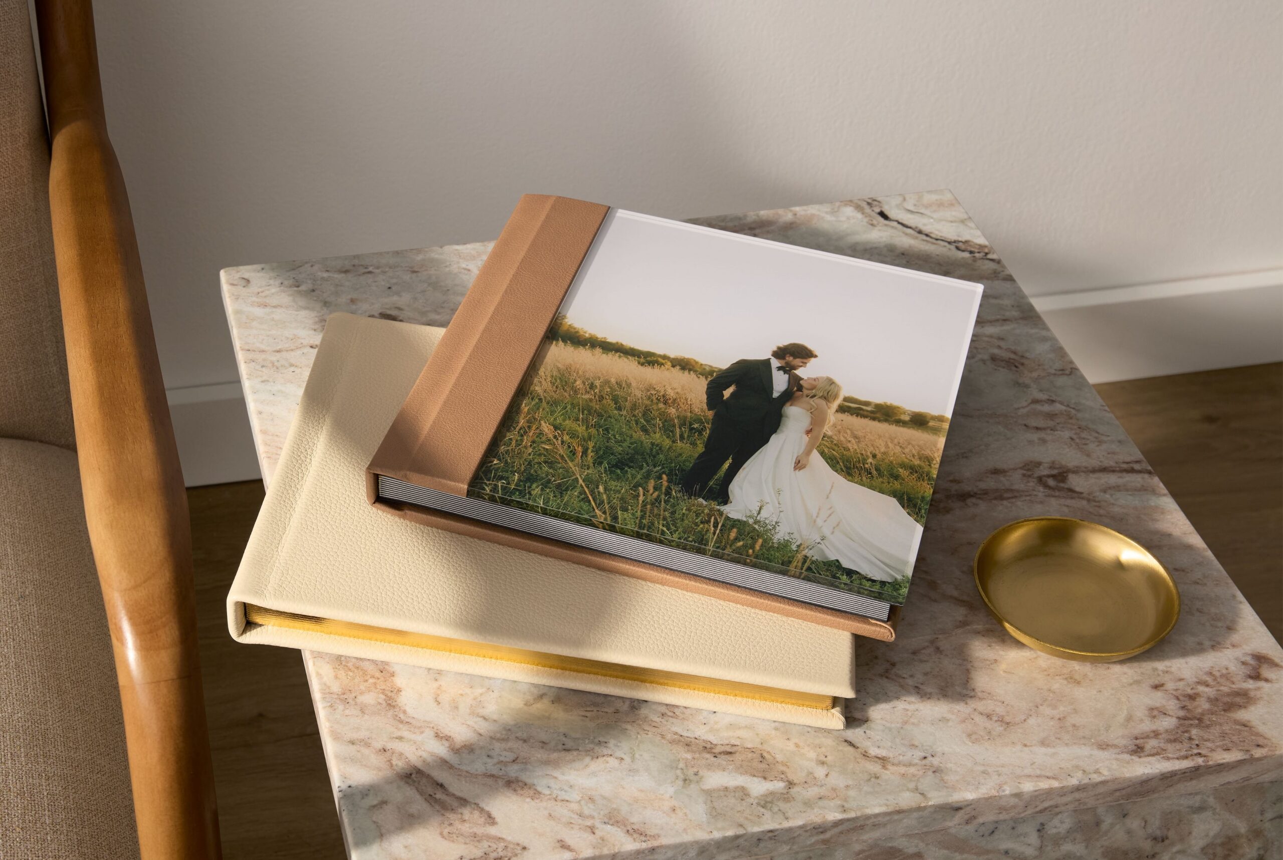two premium flush mount wedding photo books with gilded edges
