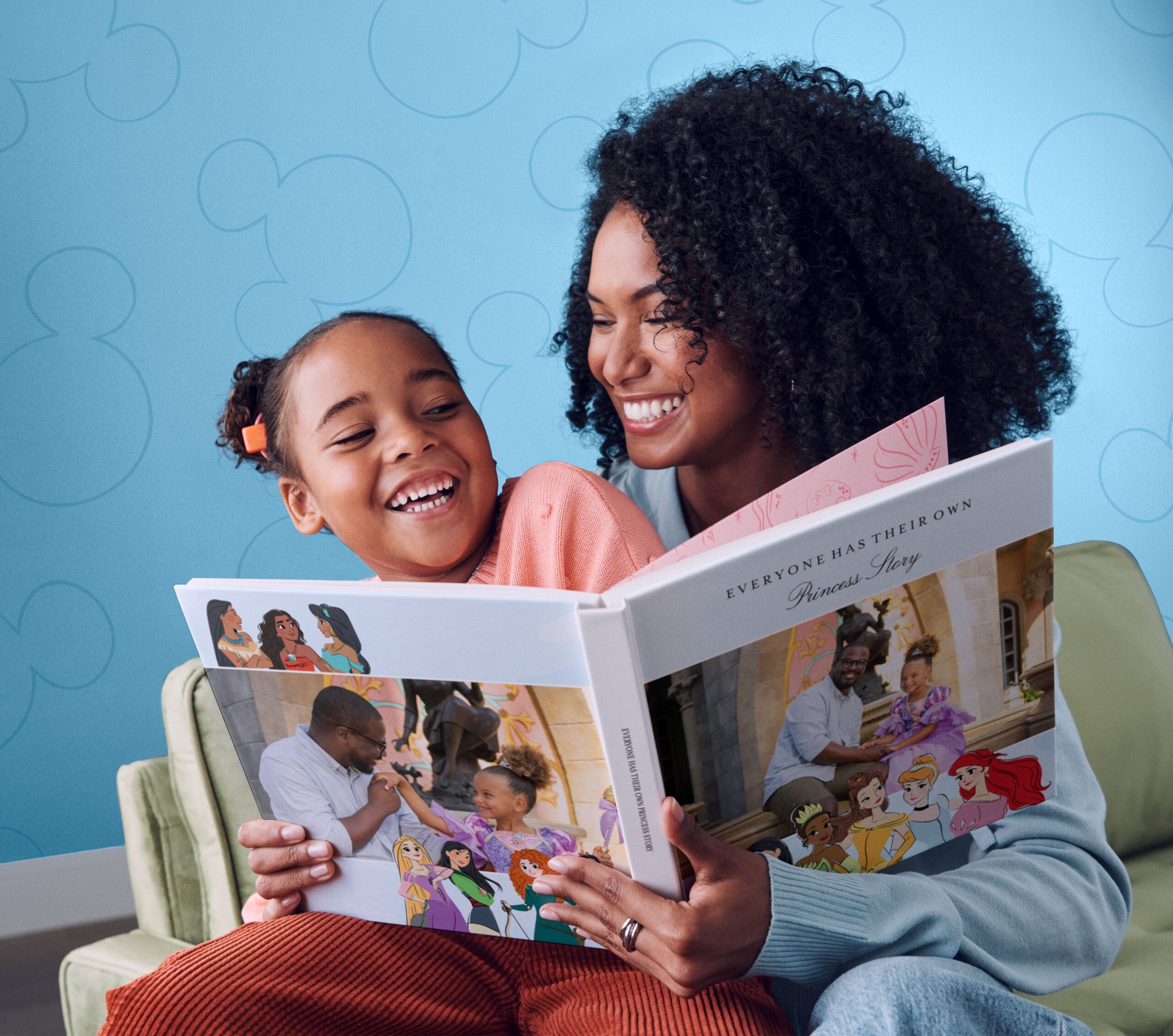 Mom and daughter looking at Disney photo book together