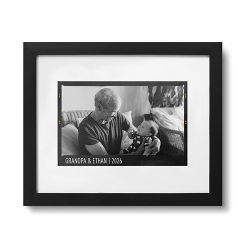 black framed print with photo of a grandpa and baby